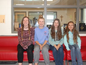 L-R: Megan Sundberg, Neige Kelly, Genie Girard and Paige Richards were instrumental in organizing the St. Michael’s 24-hour famine raising money for the Junction Food Bank in Pincher Creek. Thirty-five students stayed overnight at the school fasting. Together they raised over $2,200.