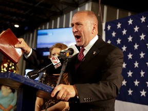 In this Dec. 10, 2016, file photo, Republican candidate Clay Higgins, with his wife, Becca, addresses supporters after his victory in Louisiana’s 3rd congressional district run-off election in Lake Charles, La. (Lee Celano/The Daily Advertiser via AP)