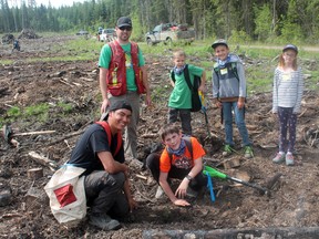 lockwise from bottom: Whitecourt Central School student Tristian Peach, Evan Littauer of Blue Ridge Lumber, Kevin Wilchak of Alberta Newsprint Company and students RJ Corriveau, Noah Forster-Street, and Lili Kraft. They were participating in an initiative to have students from Central School and École St. Joseph School plant trees and learn about the forestry industry (Jeremy Appel | Whitecourt Star).