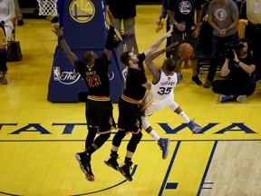 Kevin Durant of the Golden State Warriors shoots the ball against Kevin Love and LeBron James of the Cleveland Cavaliers in Game 2 of the NBA Finals at ORACLE Arena on June 4, 2017. (Ezra Shaw/Getty Images)