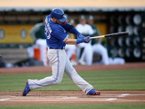 Josh Donaldson of the Toronto Blue Jays hits an RBI double in the first inning against the Oakland Athletics at Oakland Alameda Coliseum on June 5, 2017. (Ezra Shaw/Getty Images)