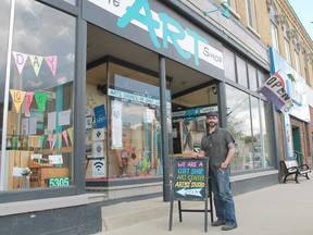 Francis Martin, of the Art Council of East Lambton, stands in front of Watford's Art Shop, one of the venues in the community’s fourth annual Art Social Day, to be held June 10. Carl Hnatyshyn/Postmedia Network