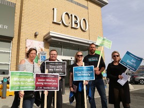 LCBO unionized employees and supporters hold an information picket in Sudbury on May 19, 2017. (John Lappa/Postmedia Network)