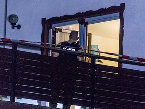 This June 3, 2017 photo shows a policeman at a home for asylum-seekers in Arnschwang, Germany. (Armin Weigel/dpa via AP)