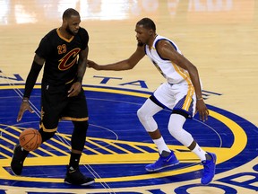 LeBron James #23 of the Cleveland Cavaliers is defended by Kevin Durant #35 of the Golden State Warriors during the second half of Game 2 of the 2017 NBA Finals at ORACLE Arena on June 4, 2017 in Oakland, California. (Photo by Ronald Martinez/Getty Images)
