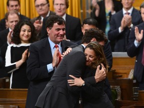 Minister of Foreign Affairs Chrystia Freeland is congratulated by Prime Minister Justin Trudeau and party members after delivering a speech in the House of Commons on Canada's Foreign Policy in Ottawa on Tuesday, June 6, 2017. THE CANADIAN PRESS/Sean Kilpatrick