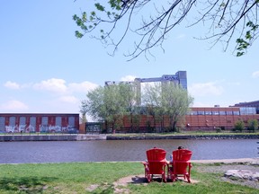 Pull up a red Parks Canada chair and enjoy the views along the Lachine Canal in Montreal. JIM BYERS PHOTO