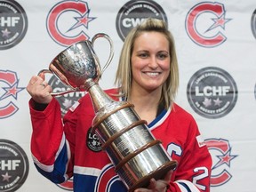 Marie-Philip Poulin, captain of Les Canadiennes de Montreal, the Canadian Women's Hockey League champions, poses for photos with the Clarkson Cup in Brossard, Que. (THE CANADIAN PRESS/Ryan Remiorz)