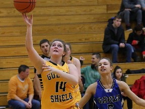 Megan Desormeaux, left, of Cambrian College, drives past Mercedes Ryan, of Sault College, during women's basketball action at Cambrian College in Sudbury, Ont. on Saturday January 21, 2017. John Lappa/Sudbury Star/Postmedia Network