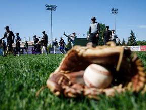 Players warm up during the Edmonton Prospects' open tryouts at Re/Max Field in Edmonton on Saturday, May 27, 2017.