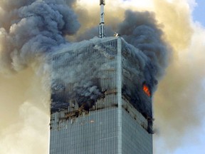 In this Tuesday, Sept. 11, 2001 file photo, fire and smoke billows from the north tower of New York’s World Trade Center after terrorists crashed two hijacked airliners into the World Trade Center and brought down the twin 110-story towers. (AP Photo/David Karp, File)