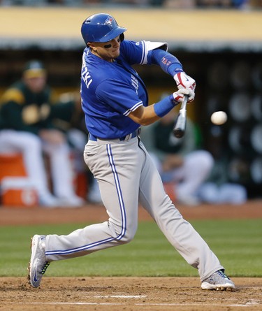 Toronto Blue Jays' Troy Tulowitzki connects for an RBI single off Oakland Athletics' Jesse Hahn in the fourth inning of a baseball game Tuesday, June 6, 2017, in Oakland, Calif. (AP Photo/Ben Margot) ORG XMIT: OAS107