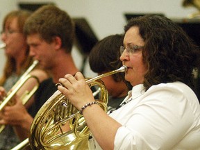 Wallaceburg Community Concert Band member Debi Shattler performs on the French Horn, during the concert band's community concert held on Tuesday, May 30 at Wallaceburg District Secondary School.
