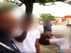An image captured from a Facebook video appears to show a group of teens assaulting a disabled man. (CBS Philly)