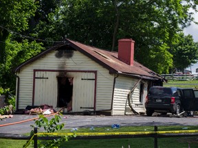 Police tape cordons off the scene where Strasburg Fire Chief John Stoltzfus said a mother and her two young children were found shot to death after their home was found burning under suspicious circumstances, Tuesday, June 6, 2017, in Strasburg, Pa. (Mark Pynes/PennLive.com via AP)