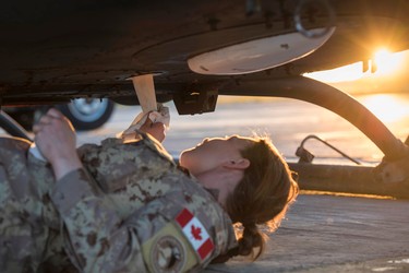A Canadian Armed Forces Avionics Systems Technician inspects and cleans a CH-146 Griffon helicopter at Camp Érable, Iraq during Operation IMPACT on April 25, 2017.

Photo: Op Impact, DND