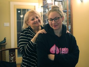 Lindsey Finkelstein, 22 years, right, is conforted by her mother, Merle, left, at their home on November 2, 2016, one day before going through surgery. (Marie-France Coallier/MONTREAL GAZETTE)