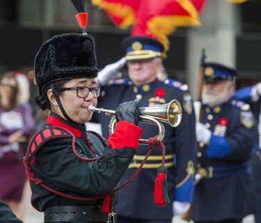 Musician Alethea Song, The Queen's Own Rifles of Canada, plays reveille during the commemoration of the 73rd anniversary of D-Day and the Battle of Normandy during the Second World War at a ceremony held at Nathan Phillips Square in Toronto, Ont. on Tuesday June 6, 2017. Ernest Doroszuk/Toronto Sun/Postmedia Network