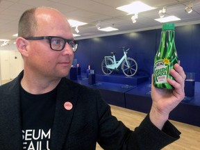 In this photo taken on Thursday, June 1, 2017, Samuel West, curator of the Museum of Failure, holds a bottle of Heinz ‘Green Sauce’ tomato ketchup at the Museum of Failure in Helsingborg, Sweden. Green Heinz ketchup? Fat-free Pringles? Colgate frozen lasagna? You don't need to be an expert to know they weren't successful. Which is why these creations, with dozens of others, feature in the new Museum of Failure, a wacky parade of rejected products from years gone by. (AP Photo/James Brooks)