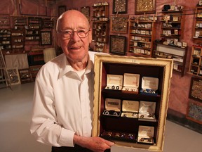 John Scott, 90, pictured with some of the estimated 5,000 pairs of cufflinks in his collection. The Sarnia man has been collecting for about 50 years. (Tyler Kula/Sarnia Observer)