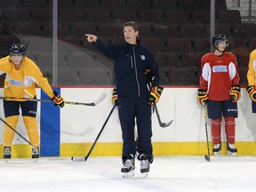 Erie Otters hockey head coach Kris Knoblauch gestures during a team practice at Erie Insurance Arena in Erie, Pa., on Sept. 29, 2015. Knoblauch has been hired as an assistant coach for the Philadelphia Flyers NHL team. (Greg Wohlford/Erie Times-News via AP)