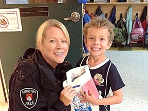 Kingston Police Const. Valerie Hurding, with J.R. Henderson Public School senior kindergarten student Carter Noble after Carter wrote a letter to Kingston Police. (Kingston Police submitted photo)