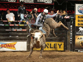 Lachlan Richardson attempts to ride Dakota Rodeo/Chad Berger/Clay Struve/Julie Rosen's American Sniper during the first round of the Kansas City Built Ford Tough series PBR. Photo by Andy Watson/Bull Stock Media. ANDY WATSON / -
