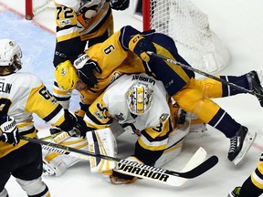 Filip Forsberg of the Nashville Predators collides with Matt Murray of the Pittsburgh Penguins during the third period in Game 4 of the Stanley Cup Final at the Bridgestone Arena on June 5, 2017. (Bruce Bennett/Getty Images)