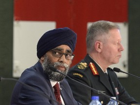 Defence Minister Harjit Sajjan unveils the Liberal government?s long-awaited vision for expanding the Canadian Armed Forces Wednesday in Ottawa as Chief of the Defence Staff Gen. Jonathan Vance looks on. (Adrian Wyld/The Canadian Press)