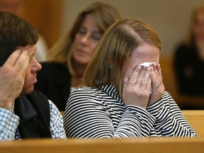 Roy family members react when crime-scene photos are projected during the trial of Michelle Carter, Tuesday, June 6, 2017, in Taunton, Mass. (Pat Greenhouse/The Boston Globe via AP, Pool)