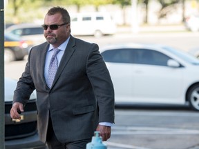 Niagara Regional Police officer Scott Heron enters the courthouse in Welland in this file photo.