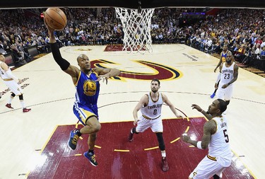 David West #3 of the Golden State Warriors goes up with the ball against Kevin Love #0 and JR Smith #5 of the Cleveland Cavaliers in the second half in Game 3 of the 2017 NBA Finals at Quicken Loans Arena on June 7, 2017 in Cleveland, Ohio. (Photo by Kyle Terada - Pool/Getty Images)