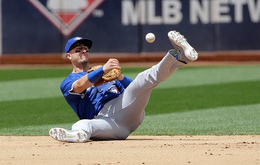 Toronto Blue Jays shortstop Troy Tulowitzki throws to second base on a double play ground ball hit into by Oakland Athletics' Khris Davis during the fifth inning of a baseball game in Oakland, Calif., Wednesday, June 7, 2017. (AP Photo/Jeff Chiu)