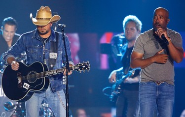Jason Aldean, left, and Darius Rucker perform "Midnight Rider" during a tribute to Greg Allman at the CMT Music Awards at Music City Center on Wednesday, June 7, 2017, in Nashville, Tenn. (Photo by Wade Payne/Invision/AP) ORG XMIT: TNPM119