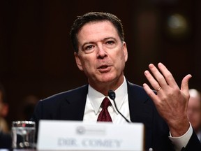 Former FBI director James Comey testifies during a US Senate Select Committee on Intelligence hearing on Capitol Hill in Washington, DC, June 8, 2017.  (AFP PHOTO / Brendan Smialowski)