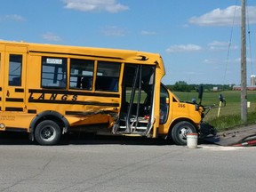 A crash involving this school bus and two other vehicles on London?s outskirts sent eight people, including six students, to hospital Wednesday. The bus driver faces a Highway Traffic Act charge. (OPP supplied photo)