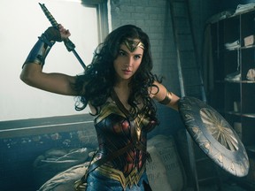This image released by Warner Bros. Entertainment shows Gal Gadot in a scene from "Wonder Woman." The film grossed $103.1 million in North America over its debut weekend, a figure that easily surpassed industry expectations, set a new record for a film directed by a woman and bested all previous stand-alone female superhero movies put together. (Clay Enos/Warner Bros. Entertainment via AP)