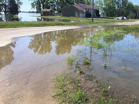 BRUCE BELL/THE INTELLIGENCER
After a couple of days of sunshine, Wallbridge Circle in Prince Edward County finally started to dry up. The road remains open only to local traffic and homeowners in the Ameliasburgh neighbourhood say the road will likely be under water again when it rains.