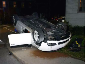 The driver of this car calmly waited for police in a nearby patio chair. He faces a number of drinking and driving offences. (STEPH CROSIER / POSTMEDIA)