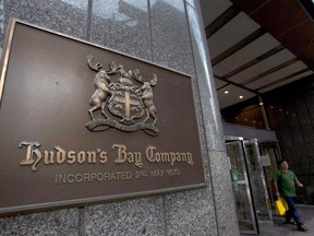 A Hudson's Bay Co. store sign is shown at its Toronto flagship store on July 29, 2013. Hudson's Bay Co. says it is cutting 2,000 jobs, including some it says were previously announced in February. (THE CANADIAN PRESS/Nathan Denette)