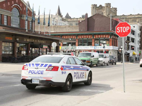 Police car driving through the Byward Market on March 30, 2016. (Robyn Hertz)