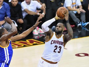 LeBron James of the Cleveland Cavaliers is defended by Kevin Durant of the Golden State Warriors during Game 3 of the NBA Finals at Quicken Loans Arena on June 7, 2017. (Jason Miller/Getty Images
