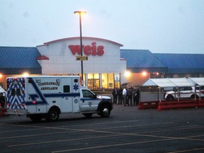 An ambulance waits outside of a Weis Market, the scene of a shooting in Tunkhannock, Pa., on Thursday, June 8, 2017. (Robert Baker/The Times & Tribune via AP)