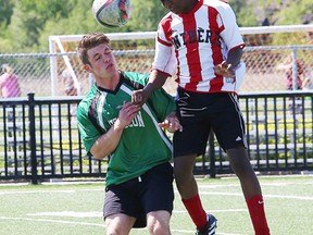 John Grilles, left, of Horizon Aigles, and a  Macdonald-Cartier Pantheres player battle for the ball during boys high school soccer division II final action at James Jerome Sports Complex in Sudbury, Ont. on Thursday June 8, 2017. John Lappa/Sudbury Star/Postmedia Network