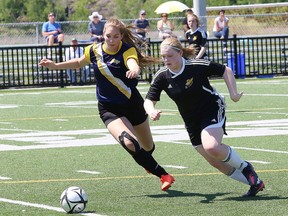 Crystal McLennan, left, of Bishop Alexander Carter Golden Gators, and Abby Carter, of the Lively Hawks, battle for the ball during girls high school division II soccer final action at James Jerome Sports Complex in Sudbury, Ont. on Thursday June 8, 2017. John Lappa/Sudbury Star/Postmedia Network