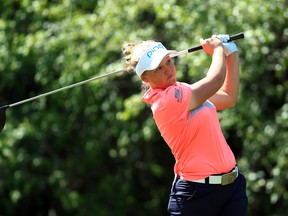 Canada’s Brooke Henderson hits her tee shot on the 18th hole during the first round of the Manulife LPGA Classic at Whistle Bear Golf Club in Cambridge yesterday. (Getty images)