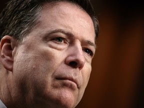 Fired FBI director James Comey recounts a series of conversations with President Donald Trump as he testifies before the Senate Select Committee on Intelligence, on Capitol Hill in Washington, Thursday, June 8, 2017. Comey alleges Trump repeatedly pressed him for his "loyalty" and directly pushed him to "lift the cloud" of investigation by declaring publicly the president was not the target of the probe into his campaign's Russia ties.   (AP Photo/J. Scott Applewhite)