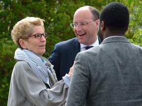 Ontario Premier Kathleen Wynne greets London Mayor Matt Brown following an announcement about high-speed rail last month in London. (MORRIS LAMONT, The London Free Press)