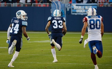 Toronto Argonauts Aaron Berry DB (33) picks off a ball and runs it back for a TD in the second quarter during pre-season CFL action in Toronto, Ont. on Thursday June 8, 2017. Jack Boland/Toronto Sun/Postmedia Network