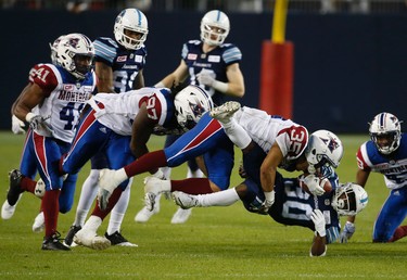 Montreal Alouettes Jalen Rogers DB (35) jams Toronto Argonauts Martese Jackson RB (30) into the field in the fourth quarter during pre-season CFL action in Toronto, Ont. on Thursday June 8, 2017. Jack Boland/Toronto Sun/Postmedia Network